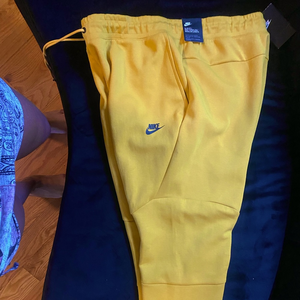 Yellow Nike Tech sweatpants never worn new with tags open to reasonable offers.